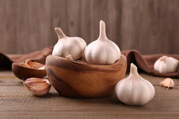Fresh garlic on wooden table, closeup view