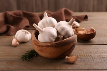 Fresh garlic on wooden table, closeup view
