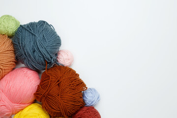 Color yarn for knitting, white background. Top view. Copy space, flat lay