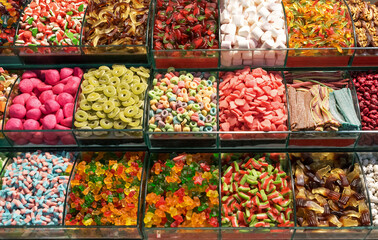 Piles of colorful jelly sweets sold outside on a market stall