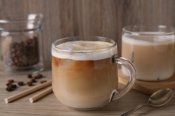 Cup of fresh coffee on wooden table, closeup