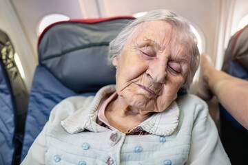 old woman sleeping, grandmother sleeps, elderly person asleep, person sitting on a plane