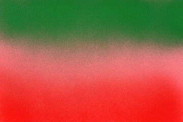 green and red spray paint on a pink color paper background