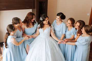 Portrait of the bride with her friends. Elegant and stylish bride with her friends in matching...