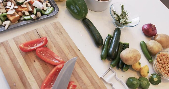 Fresh vegetables are ready for chopping on a kitchen counter