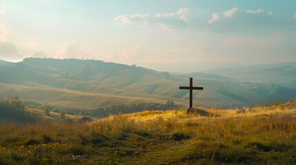 A backdrop of rolling hills behind the Cross of Jesus illustrating the journey of faith