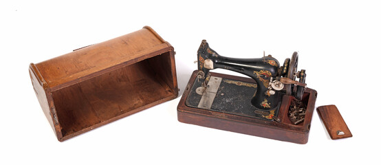 Broken old sewing machine, isolated on white
