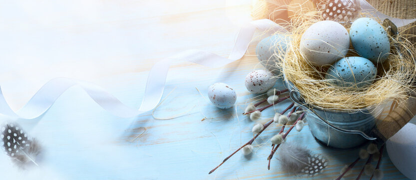 Happy Easter;  Easter eggs on blue table background