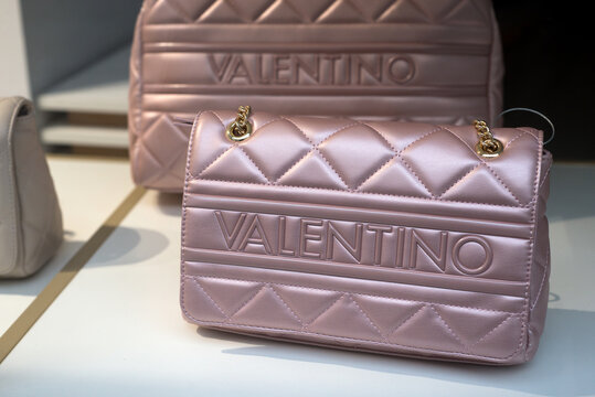 Mulhouse - France - 18 February 2024 - Closeup of pink Valentino hand bag in a luxury fashion store showroom