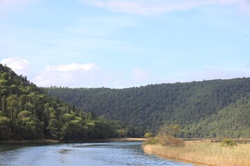 Picturesque view of beautiful river in mountains under sky