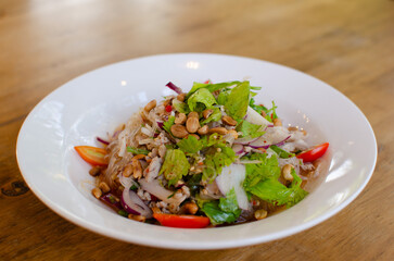 Spicy Glass Noodle Salad,mixed herbs with minced pork with boiled vermicelli in chili sauce. (Yum Woon Sen), Asian spicy food menu.