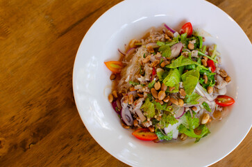 Spicy Glass Noodle Salad,mixed herbs with minced pork with boiled vermicelli in chili sauce. (Yum Woon Sen), Asian spicy food menu. Shot from top view. © 2DogsHouse