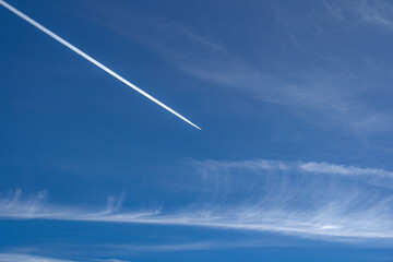 Blue sky Background and Jet contrails - Powered by Adobe