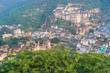 Fototapeta na wymiar Elevated view of Bundi surrounded by Aravalli hills and trees. Rajasthan, India.