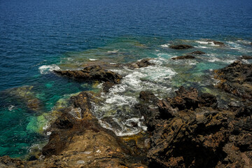 Beautiful rocks and turquoise sea on the coast of the Canary Islands, Tenerife Spain.	