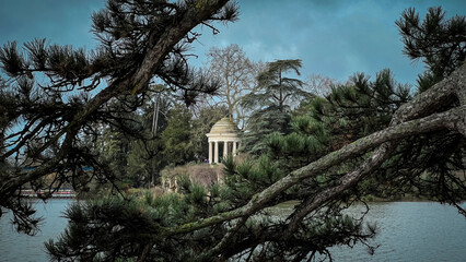 Romantic city park with beautiful lake in autumn sunny day. Daumesnil lake in Vincennes forest of Paris, France.