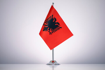 Albania flag with a gray and clean background.