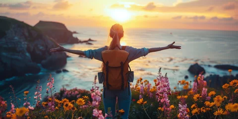 Deurstickers Woman Embracing Nature at Sunset. A woman with open arms at cliffside sunset. © AI Visual Vault