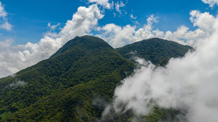 Tropical landscape with mountain hills and greenery foliage. Camiguin Island. Philippines.