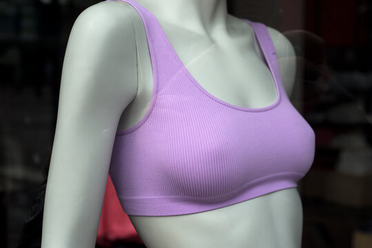 Closeup of pink fitness bra on mannequin in fashion store showroom