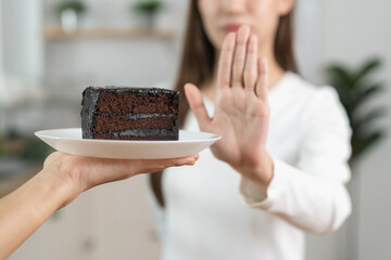 Diet, Dieting asian young woman, girl hand gesture push out rejecting eat chocolate cake, sweet...