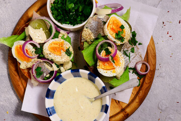 Polish bread with herring with eggs  and  sauce.top veiw