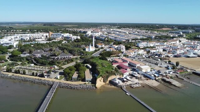 Aerial panoramic view of El Rompido beach village with Marina El Rompido Sports Port and the Piedras river
