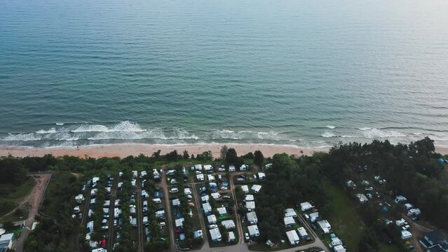 Aerial view of campsite with trailers near Baltic sea beach in Wladyslawowo, Poland. Tourists have rest during summer vacation season