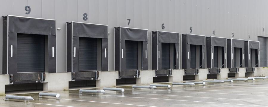 Row of gray loading docks of a warehouse or distbution center