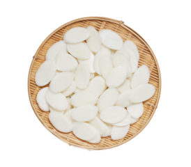 slice Tteok or slice Korean rice cake in wooden bowl isolated on white background. flat lay overhead