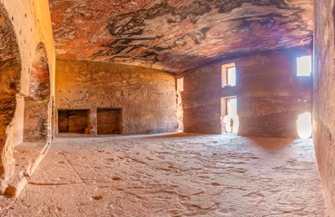 Fotobehang Inside the carved out interior of the Urn Tomb in Petra, Jordan.  © Nick Brundle