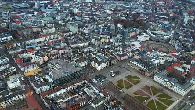 Aerial around the downtown of the city  Kassel in Hessen, Germany on a cloudy day in early spring.
