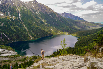 spectacular panorama of Morskie Oko mountain lake and hiking destination  - obrazy, fototapety, plakaty