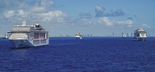 Huge modern cruiseship or cruise ship liner Divina at sea in summer during Caribbean cruising dream...