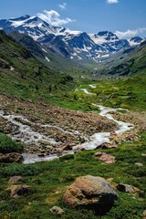 Alpine panorama with a small river during the summer in the South Tyrol
