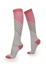 Close-up shot of a pair of high compression socks. Pink and gray medical compression stockings for the prevention of varicose veins are isolated on a white background. Side view.