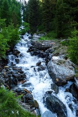 Obraz premium Alpine panorama with waterfall during the summer in the South Tyrol
