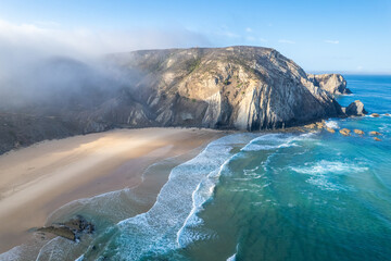 Aerial drone view of Cordoama Beach in Portugal with sandy shore, cliffs and ocean - 740914983