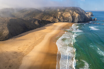 Aerial drone view of Cordoama Beach in Portugal with sandy shore, cliffs and ocean - 740915715