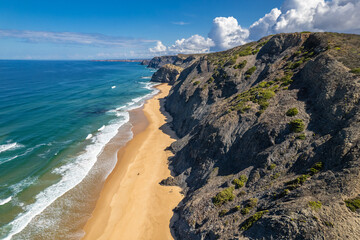 Aerial drone view of Cordoama Beach in Portugal with sandy shore, cliffs and ocean - 740916135