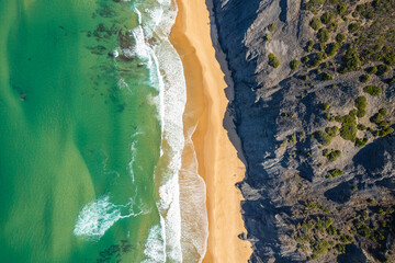 Aerial drone view of Cordoama Beach in Portugal with sandy shore, cliffs and ocean - 740916305