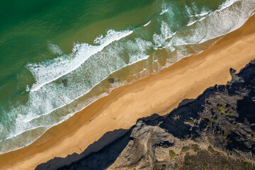 Aerial drone view of Cordoama Beach in Portugal with sandy shore, cliffs and ocean - 740916779
