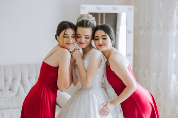 Portrait of the bride with her friends. Elegant and stylish bride with her friends in matching...