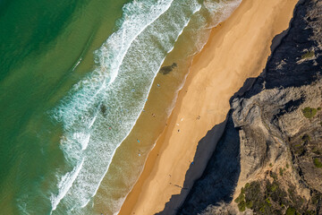Aerial drone view of Cordoama Beach in Portugal with sandy shore, cliffs and ocean - 740917113