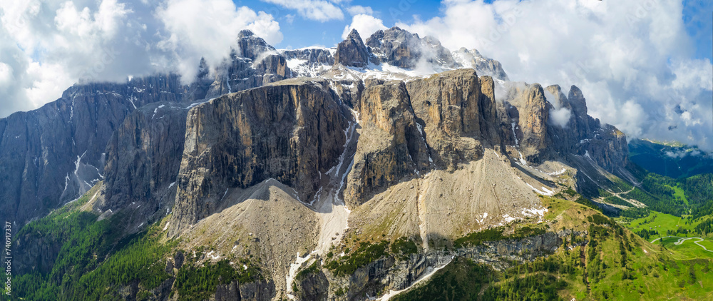 Wall mural breathtaking panorama of beautiful alps mountains dolomites, val gardena. aerial drone panoramic vie