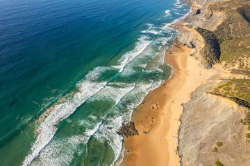 Aerial drone view of Cordoama Beach in Portugal with sandy shore, cliffs and ocean - 740917911