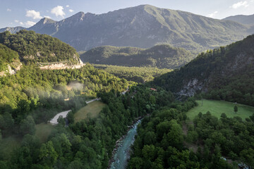 Foggy sunrise over Soca river near Kobarid in Slovenia, aerial drone view - 740918942
