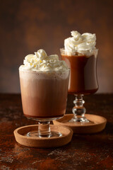 Creamy milk chocolate drinks with whipped cream.