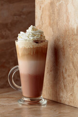 Milk coffee cocktail with whipped cream.