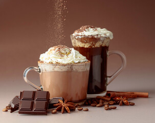 Hot chocolate and coffee with whipped cream sprinkled with chocolate crumbs.